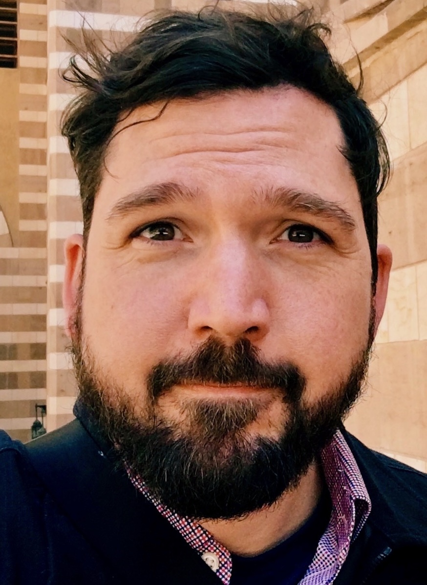 Headshot of Jesse Stommel: White man with brown hair and a beard.